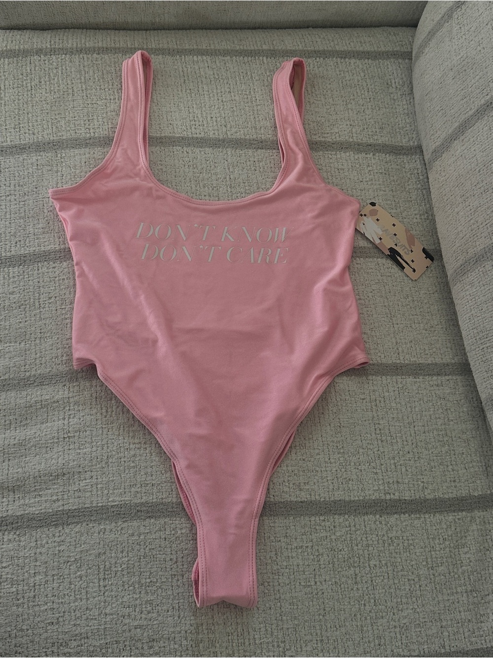Pink 'Don't Know Don't Care' One-Piece Swimsuit/ Bodysuit